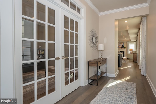 doorway featuring crown molding, dark wood-type flooring, and french doors