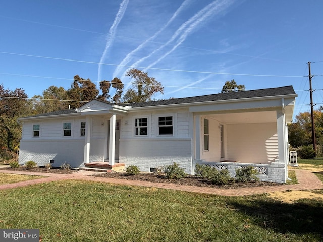 ranch-style house with a front lawn