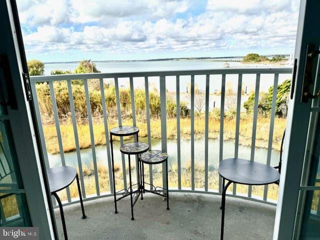 balcony featuring a water view