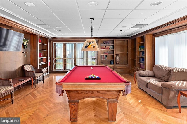 playroom featuring built in shelves, ornamental molding, parquet flooring, and billiards