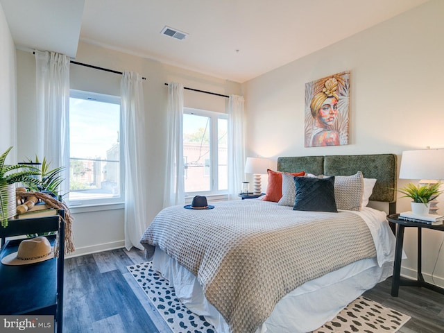 bedroom featuring dark hardwood / wood-style flooring