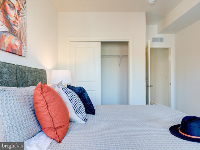 bedroom with carpet flooring and a closet