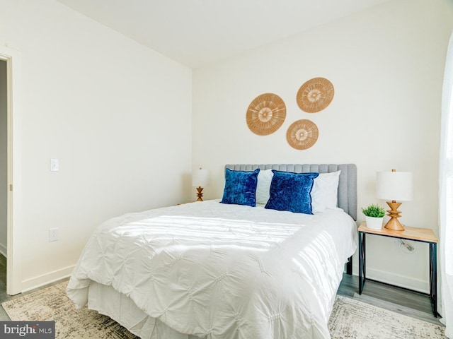 bedroom with hardwood / wood-style flooring