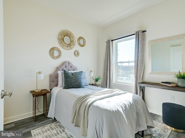 bedroom with hardwood / wood-style flooring