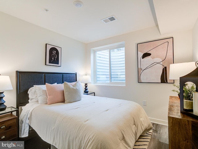 bedroom featuring dark wood-type flooring