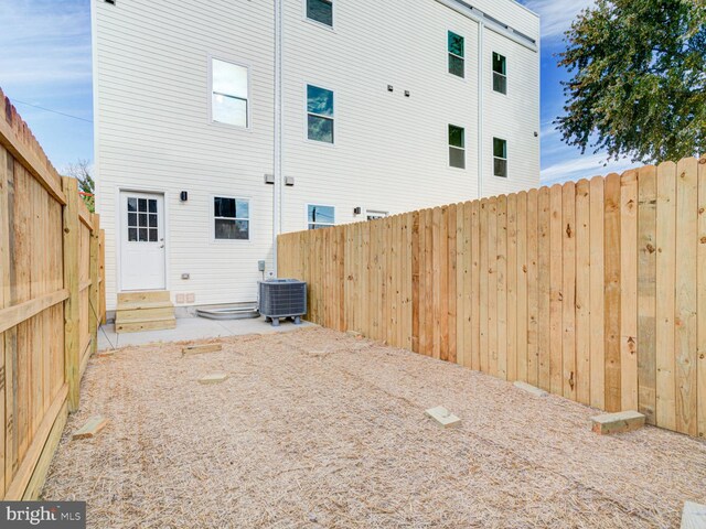 rear view of house with cooling unit