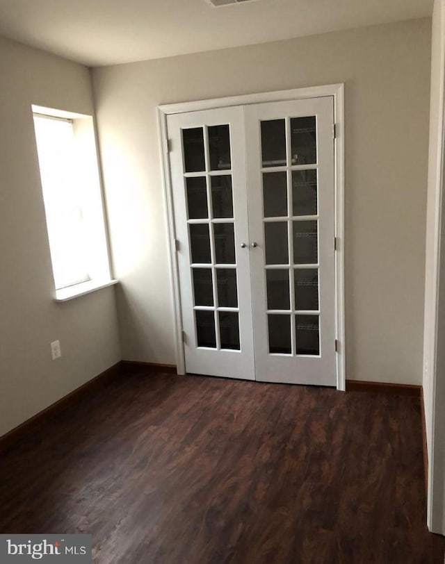 interior space featuring french doors and dark wood-type flooring