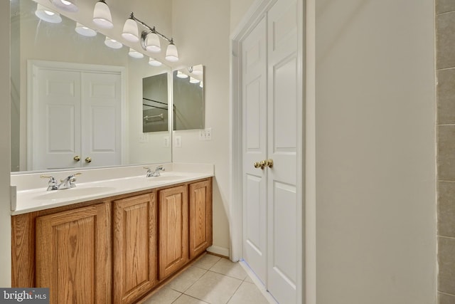 bathroom with vanity and tile patterned flooring