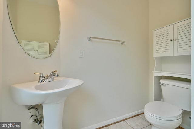 bathroom with tile patterned floors, sink, and toilet