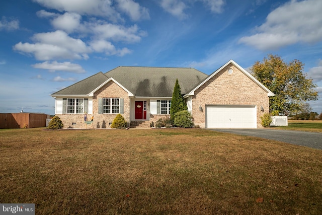 view of front of home with a garage and a front yard