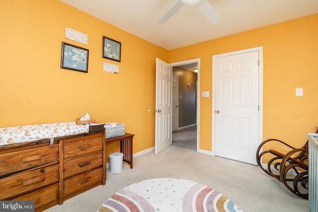 bedroom featuring light carpet and ceiling fan