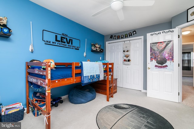 carpeted bedroom with a closet and ceiling fan