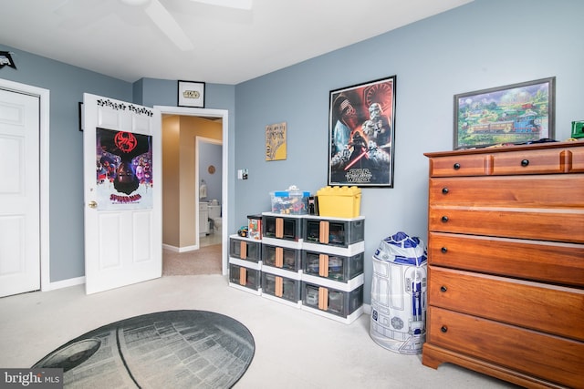 interior space with ceiling fan