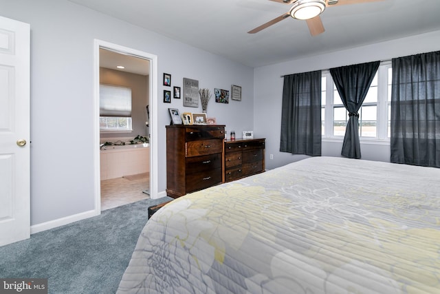 carpeted bedroom with ceiling fan and ensuite bathroom