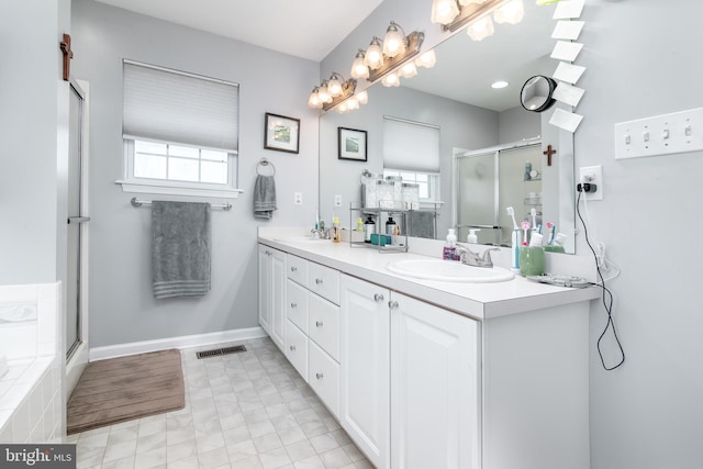 bathroom with separate shower and tub and vanity