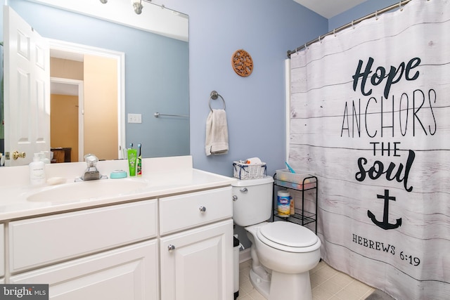 bathroom featuring tile patterned flooring, vanity, toilet, and curtained shower