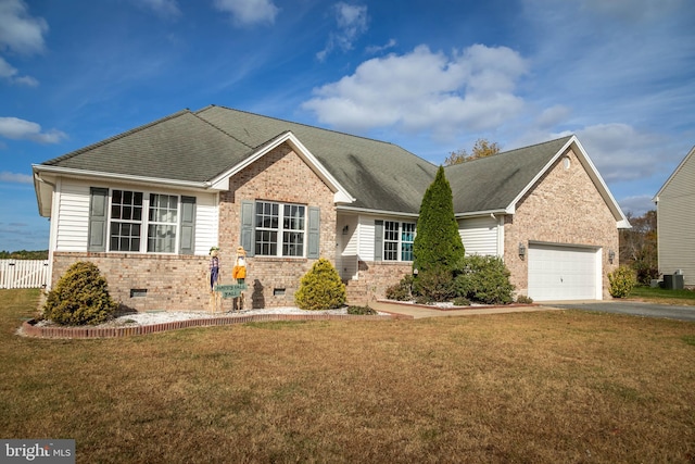 view of front facade with central AC unit, a garage, and a front lawn