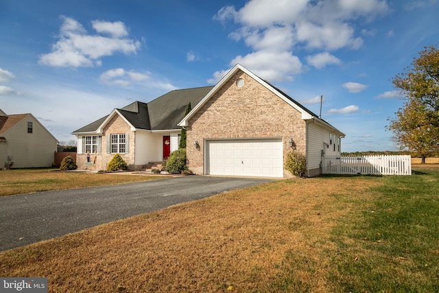 view of front of house with a front lawn and a garage