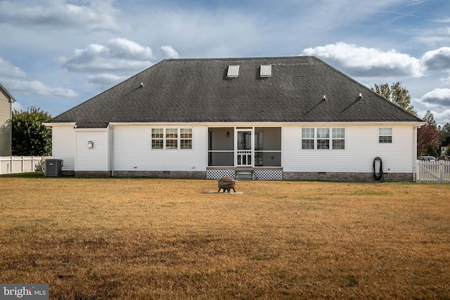 back of house with a yard, central AC unit, and a sunroom