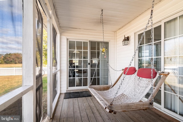 sunroom / solarium featuring wood ceiling