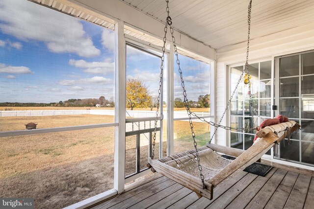 sunroom / solarium featuring wood ceiling