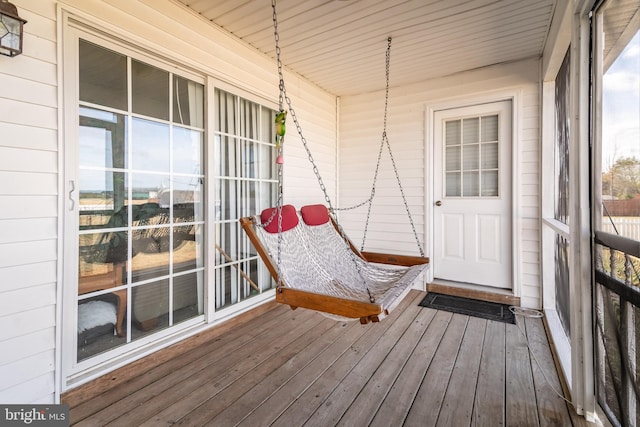 unfurnished sunroom with wooden ceiling