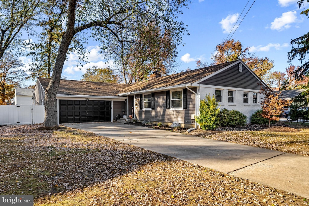 ranch-style home featuring a garage