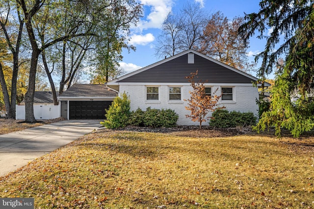 single story home with a garage and a front yard