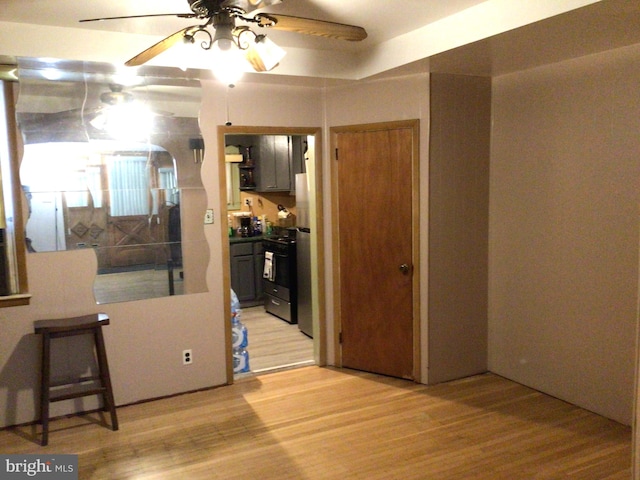 interior space with ceiling fan and light hardwood / wood-style floors