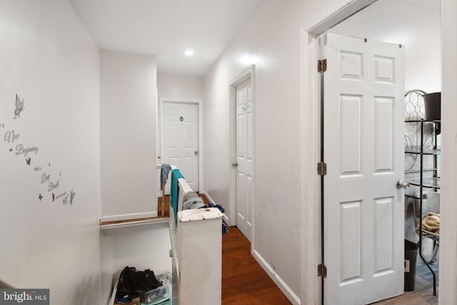 hallway featuring hardwood / wood-style flooring