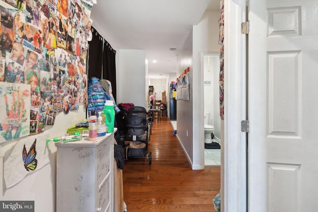 hallway featuring wood-type flooring