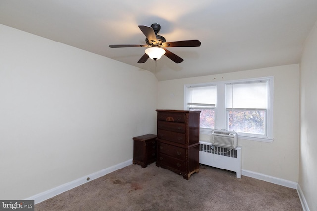 carpeted bedroom featuring radiator heating unit and ceiling fan