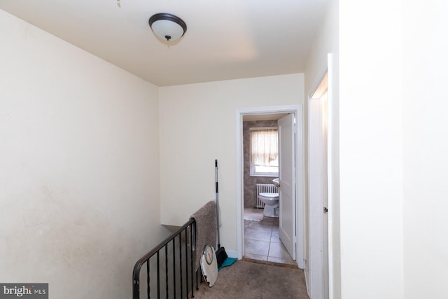 hall featuring light tile patterned floors