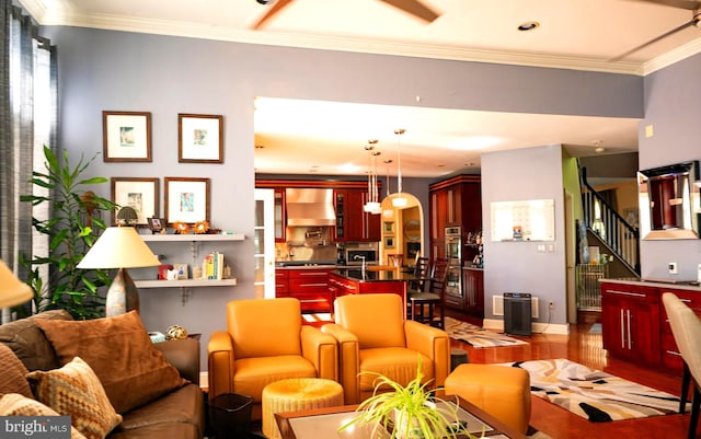 living room with light wood-type flooring and crown molding