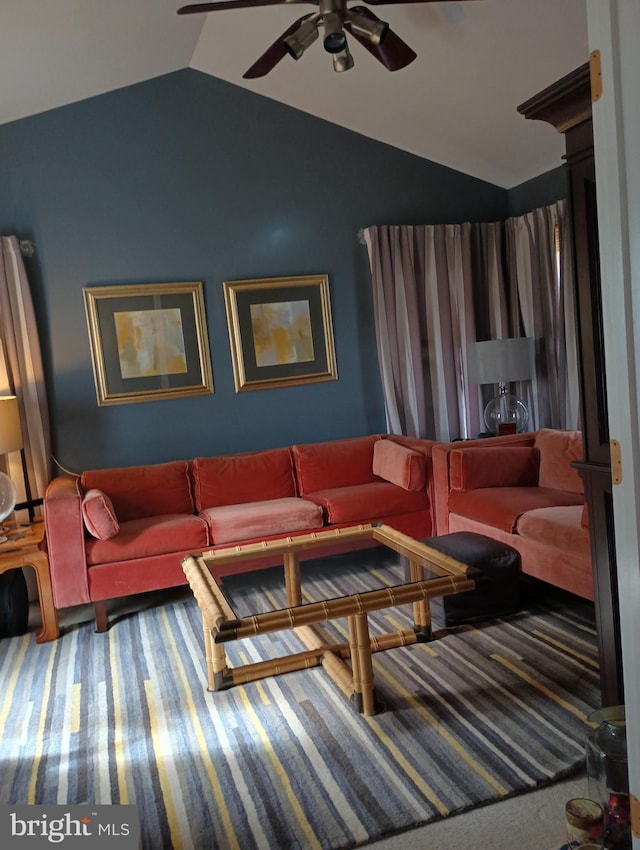 living room with lofted ceiling, carpet flooring, and ceiling fan