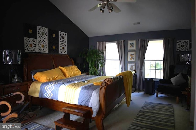 bedroom with lofted ceiling, ceiling fan, and light carpet