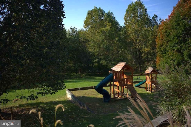 view of playground with a yard