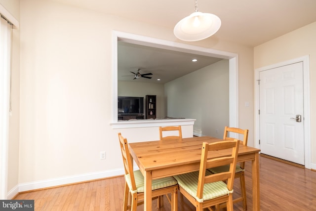 dining space featuring ceiling fan and wood-type flooring