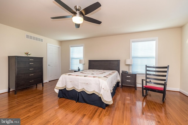 bedroom featuring hardwood / wood-style flooring and ceiling fan