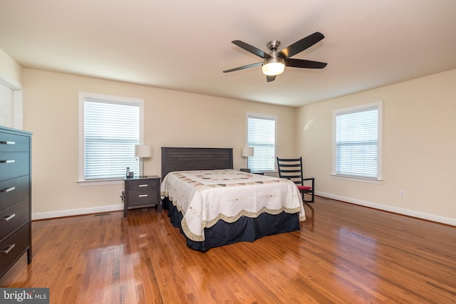 bedroom featuring dark hardwood / wood-style floors and ceiling fan