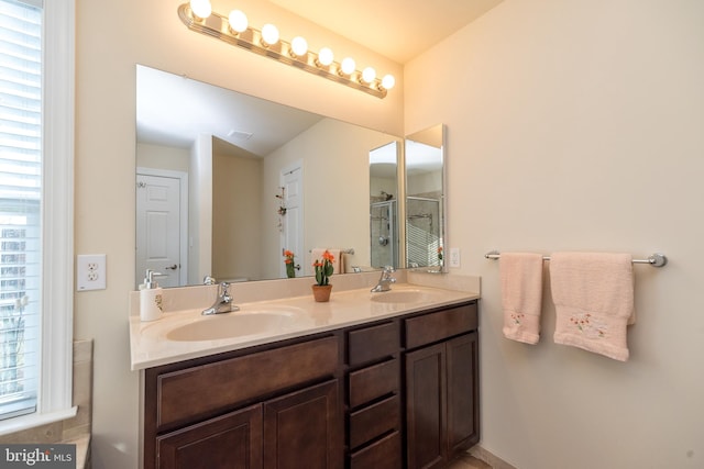 bathroom with plenty of natural light and vanity