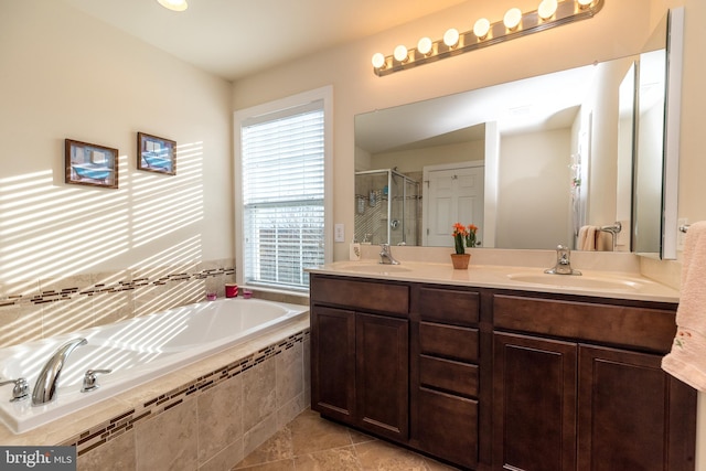 bathroom with vanity, tile patterned flooring, and separate shower and tub