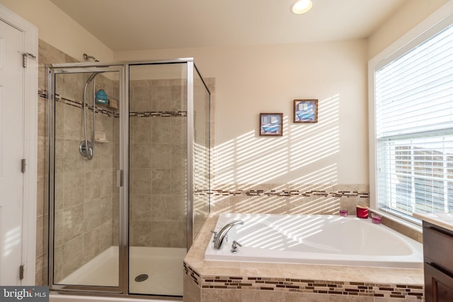 bathroom featuring vanity and separate shower and tub