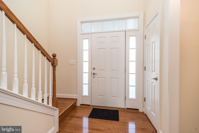 foyer entrance featuring light hardwood / wood-style floors and plenty of natural light