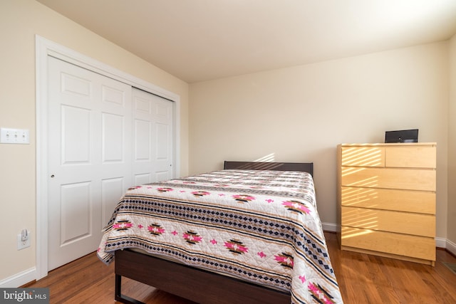 bedroom featuring hardwood / wood-style flooring and a closet