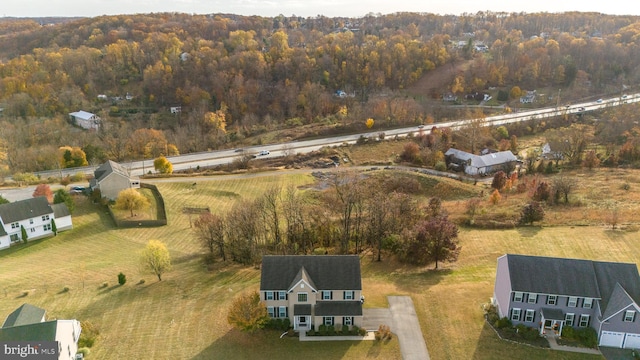 birds eye view of property with a rural view