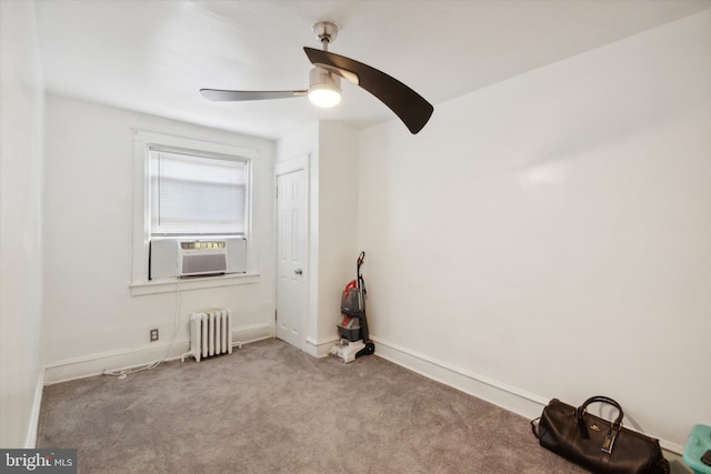 unfurnished room featuring cooling unit, light carpet, radiator heating unit, and ceiling fan