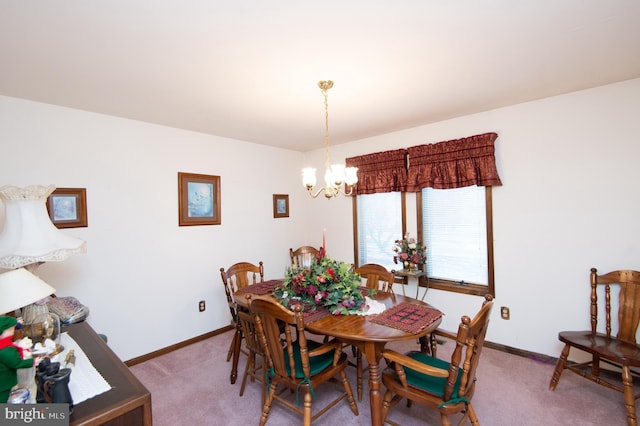 dining room featuring carpet flooring and a notable chandelier