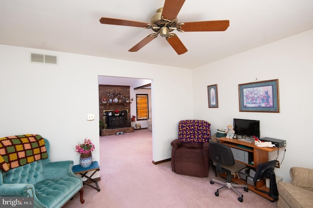 office space with light carpet and ceiling fan