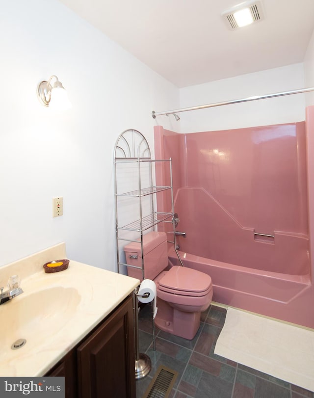 full bathroom featuring vanity, shower / bathtub combination, and toilet